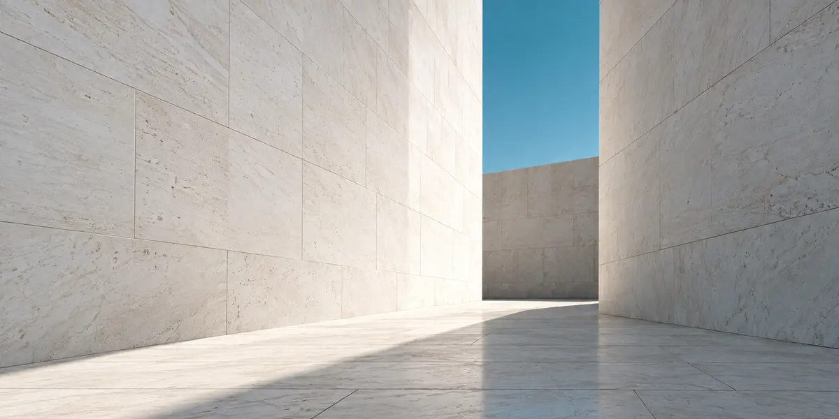 Light falling through a pale stone architectural passage
